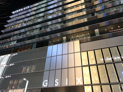 CHUO, TOKYO / JAPAN - FEBRUARY 3, 2019 : Evening scenery of Ginza 6-chome in Tokyo. Many tourists visit in an area where luxury shops are lined up. "GSIX" of a commercial facility is a landmark.