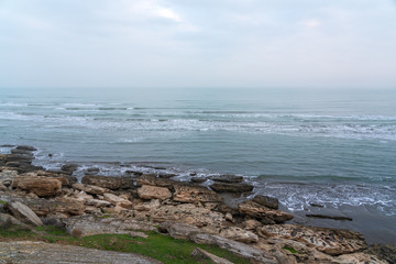 Foggy morning on the rocky sea coast