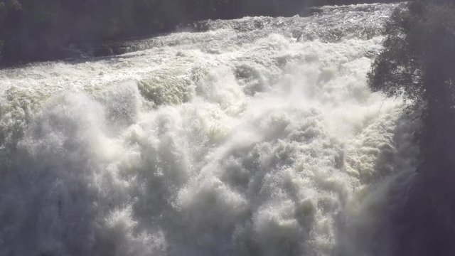 The incredible Victoria Falls on the Zambezi River. Shot from the Zimbabwe side of the river. Slow Motion.