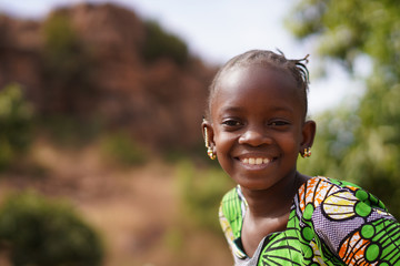 Portrait Of a Happy Little African Girl In An Natural Environment - obrazy, fototapety, plakaty