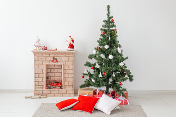Fireplace and Christmas tree with presents in living room