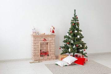 Fireplace and Christmas tree with presents in living room