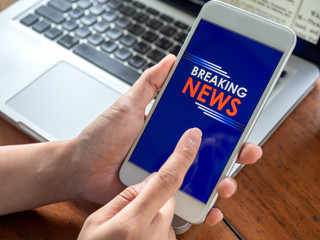 Breaking news online on smartphone.