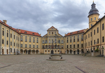 Fototapeta na wymiar The palace in Nesvizh, Belarus was build in 16-18 centoury under the cloudy sky