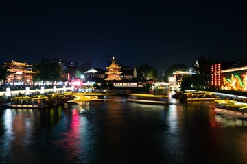 Fototapeta na wymiar Night scene over Qinhuai river in Confucius Temple in Nanjing city