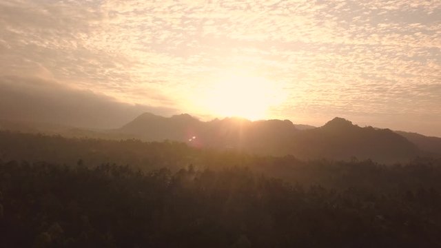 Tropical landscape at sunset. Java Island. Indonesia. Aerial forward