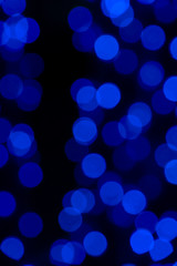 Defocused of blurred blue bokeh circle light from lighting bulb in the night for abstract background texture patterns