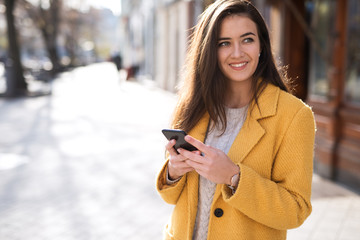 Portrait of a beautiful woman using a mobile