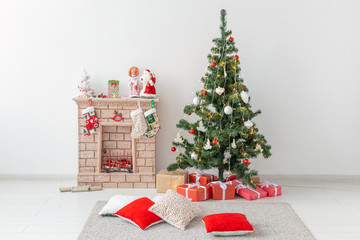 Fireplace and Christmas tree with presents in living room