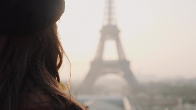 Super close-up happy woman watching foggy sunrise Eiffel Tower from Trocadero, Paris on romantic vacation slow motion.