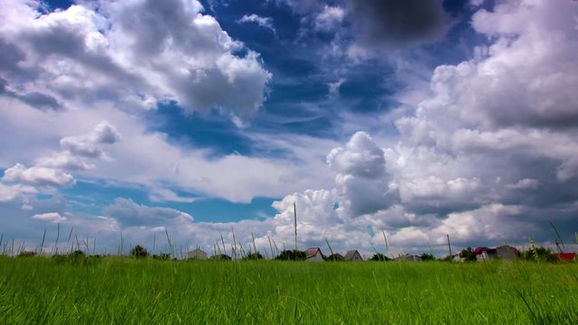 green field and cloudy sky. 4K. FULL HD, 4096x2304.