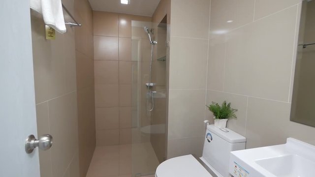 Small White Bathroom in an Apartment/ Hotel Room