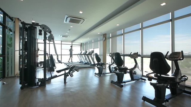 Fitness/ Exercise Room on the High Floor Buiding Showing the City View