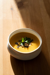 Homemade Thai Sweet Potato Soup with Cilantro, Coconut Milk Cream, Lime and Mushrooms.