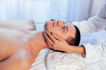 Fototapeta na wymiar male masseur doing massage health spa procedure