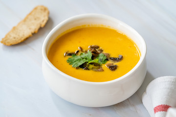 Homemade Thai Sweet Potato Soup with Cilantro, Coconut Milk Cream, Lime and Mushrooms.