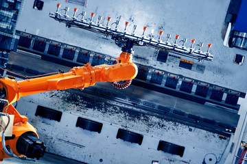 Robotic arm on heavy factory assembly line is moving