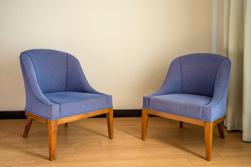 Colored chairs from fabric and suede on a laminate floor