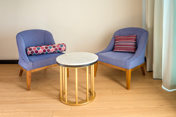 Colored chairs from fabric and suede on a laminate floor