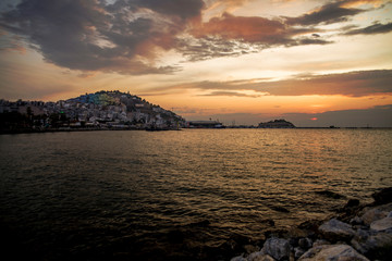 Kusadasi, Turkey - September 17, 2019: View of the coast of Kusadasi, Turkey. Sunset over the port in the tourist town.