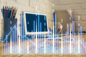 Double exposure of graph and financial info and work space with computer background. Concept of international online trading.