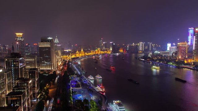 Shanghai boats sail along Huangpu river in China timelapse pan up