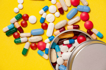 a bunch of drugs on a yellow background