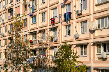 Light beige facade of a residential building. Cozy urban