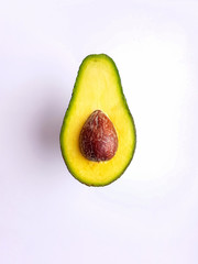 Cut ripe avocado. Isolated on a white background.