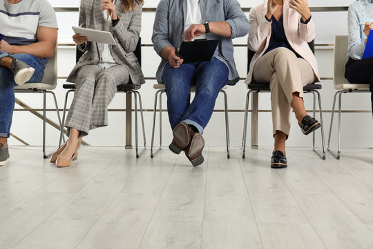 People waiting for job interview in office, closeup
