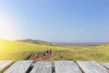 Empty table on the background of family walking on the road