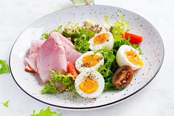 Ketogenic/paleo diet. Boiled eggs, ham, avocado and fresh salad.  Keto breakfast. Brunch.