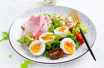 Ketogenic/paleo diet. Boiled eggs, ham, avocado and fresh salad.  Keto breakfast. Brunch.