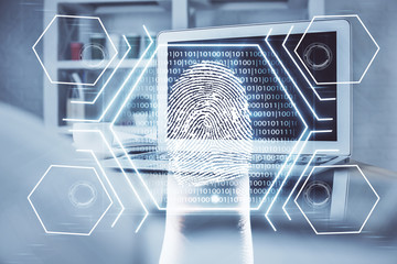 Computer on desktop in office with finger print drawing. Double exposure. Concept of business data security.