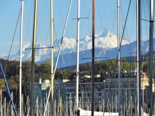 Geneva, Switzerland - October 18th 2019: a Beautiful autumn day in Lake Leman in Geneva. The Lake is surrounded by beautiful mountain that makes the sailing even more spectacular for the many sailors