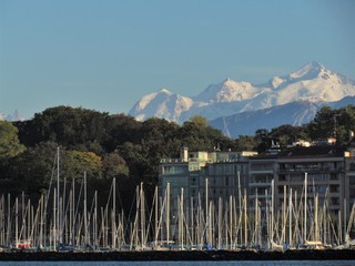 Geneva, Switzerland - October 18th 2019: a Beautiful autumn day in Lake Leman in Geneva. The Lake is surrounded by beautiful mountain that makes the sailing even more spectacular for the many sailors