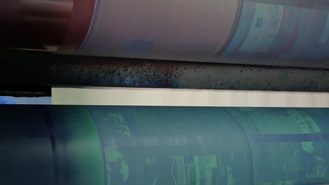 Installing new printing plates at the ink rollers of press machine