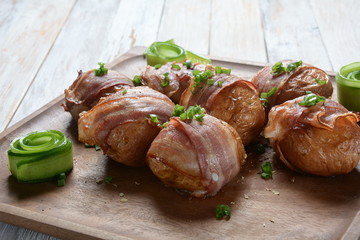 Baked, grilled baby potato wrapped in bacon