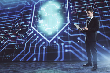 Businessman standing with business theme hologram. Multi exposure. Concept of analysis