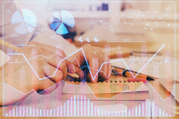 Multi exposure closeup hands with stock market forex graph.