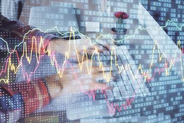 Double exposure of stock market chart with man working on computer on background. Concept of financial analysis.
