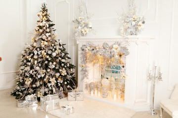 Beautiful Christmas Decorations On The White Fireplace