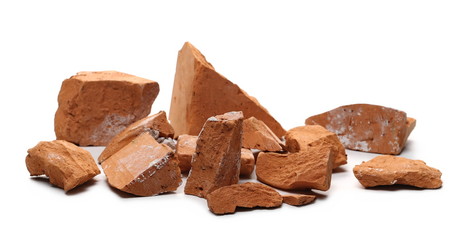 Shattered, broken bricks isolated on white background