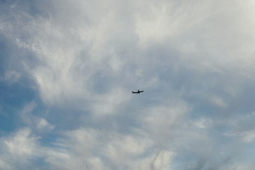 Fototapeta na wymiar a passenger plane flying in the sky over the sea v