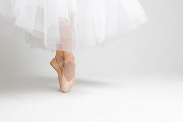 pink satin Pointe shoes on white isolated background