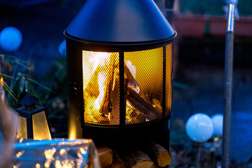 outdoor wood stove with burning open fire
