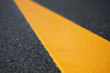 Yellow traffic paint lines during construction phase, blurred pictures