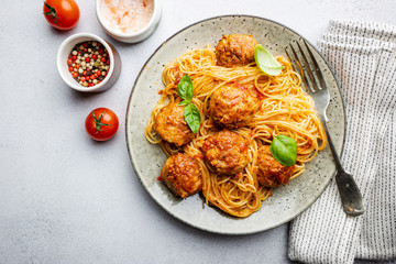 Plate of spaghetti with meatballs in tomato marinara sauce, top view