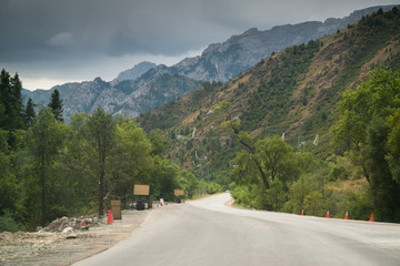 Road on the way from Bishkek to Osh with beautiful mountain range in Kyrgyzstan