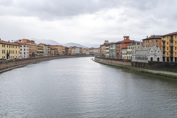 Fototapeta na wymiar Arno River through Pisa, Italy